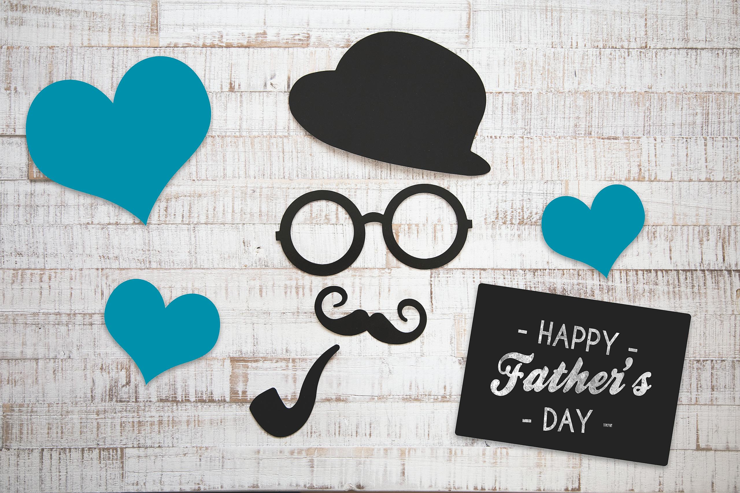 Charming Father's Day card with vintage elements on a wooden background, perfect for celebrating dads.